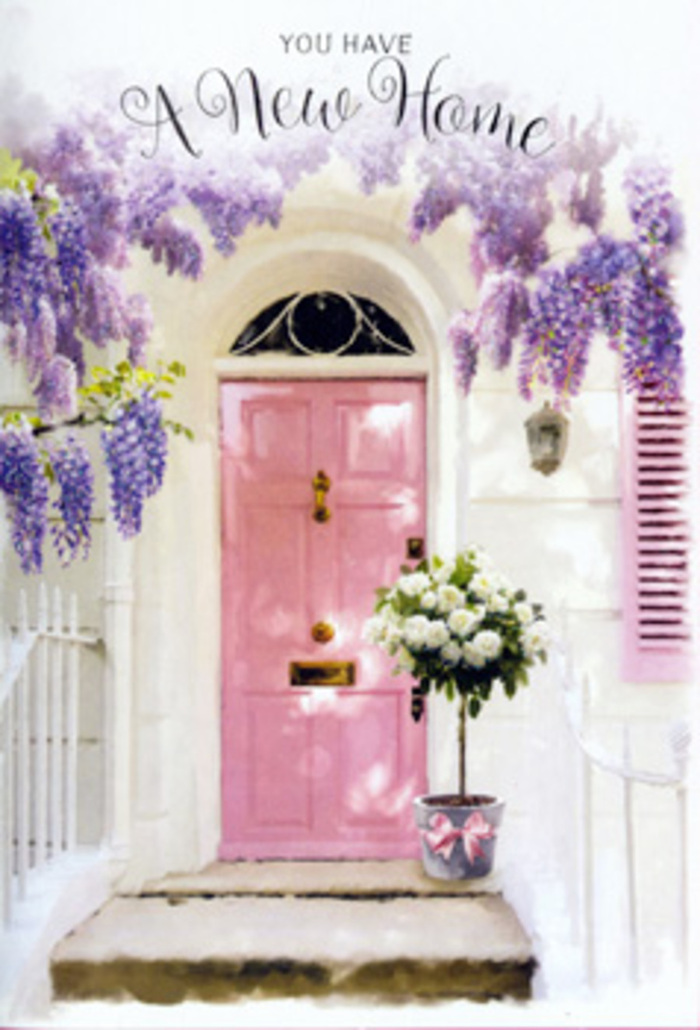In this inviting scene, a Cheshunt doorway is transformed into a subtle celebration of home, the kind of entrance you might encounter while strolling from Old Pond towards the leafy edges of town. The focal point is a soft pink front door, painted in a gentle, chalky blush that catches the afternoon light in a flattering, almost dreamy way. To one side, a similarly toned shutter and a white, lightly textured wall frame the door, creating a sense of balanced calm. Above, graceful strands of wisteria pour downward, their lavender blooms forming airy clusters that drape like fabric over the top of the composition. The blossoms suggest a sweet, slightly powdery scent carried on a faint breeze, adding another dimension to the visual charm. At ground level, right at the threshold, a stylish grey bucket holds a carefully composed arrangement of roses in shades of white and cream. Their petals are thick and velvety, unfolding layer by layer, some blooms fully open, others still held in tight buds, giving the arrangement a sense of movement and life. Interspersed among the roses are sprigs of muted green foliage, offering contrast in both colour and texture while still maintaining the overall softness of the palette. A delicate satin ribbon in pastel pink encircles the bucket, tied in an elegantly simple bow, its tails lying lazily against the stone step. The light casts gentle shadows around the doorway, creating an atmosphere of stillness and anticipation, as though this floral welcome has been arranged just moments before the new owners arrive. It feels like a quiet blessing for a Cheshunt housewarming-a thoughtful composition that cloaks the threshold in warmth, optimism, and the comforting sense that this is where new memories will soon take root.