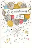In this image, a stylish congratulations card is shown standing as though it has just been signed and set beside a vase of flowers in a Cheshunt living room. The central artwork resembles a floating bouquet of balloons, each round and softly reflective, overlapping in a gentle spray of champagne cream, muted gold, silvery grey, sky blue, blush pink, and soft stone. Every balloon carries its own delicate pattern-sprinklings of tiny metallic stars, slender stripes, or glitter-like specks-that catch the eye with a quiet shimmer, recalling the subtle sparkle of morning frost on paths in Cheshunt Country Park. From the base of the balloons, slender strings drawn in tones of gold and silver curve downward in relaxed curls, crossing and looping like the playful tails of curling ribbon tied around a celebratory gift. The background is a light, neutral shade, scattered with miniature stars and curving streamers that swirl around the balloons, enhancing the impression of confetti drifting slowly to the ground after a joyful announcement. Cutting across the centre of the design is a soft, ribbon-like banner carrying the text Congratulations To You in graceful, flowing calligraphy. The writing appears slightly glossy and raised, adding a tactile element to the card's refined look. The mood is bright yet composed, ideal for expressing admiration and happiness without overwhelming sentimentality. It feels perfectly suited to moments such as a new job, academic success, or a special personal milestone. For those in Cheshunt looking to pair flowers with a message that feels sincere and polished, this card's gentle sparkle and calm elegance offer a beautiful way to say you've done brilliantly and make the achievement feel truly celebrated.